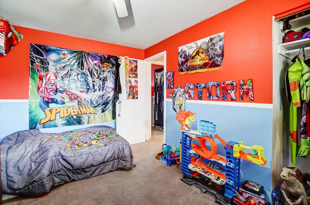 bedroom featuring ceiling fan and carpet