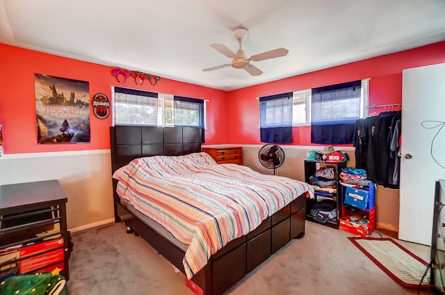 bedroom featuring carpet floors, baseboards, and a ceiling fan