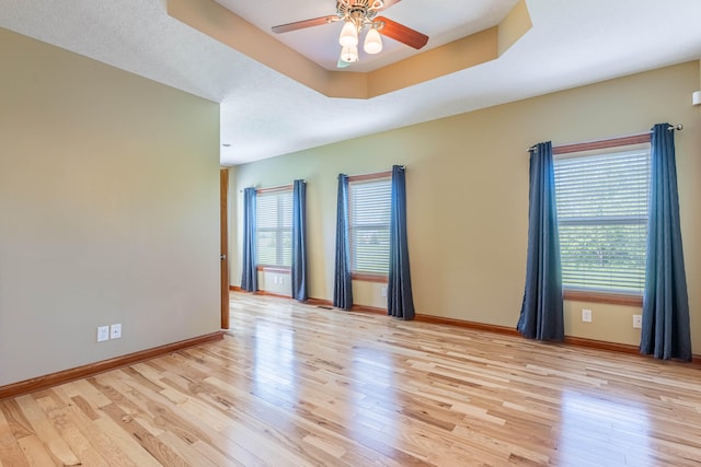 11370 Crottinger Rd, Plain City, OH 43064 - unfurnished room with light wood-style flooring, a ceiling fan, and baseboards