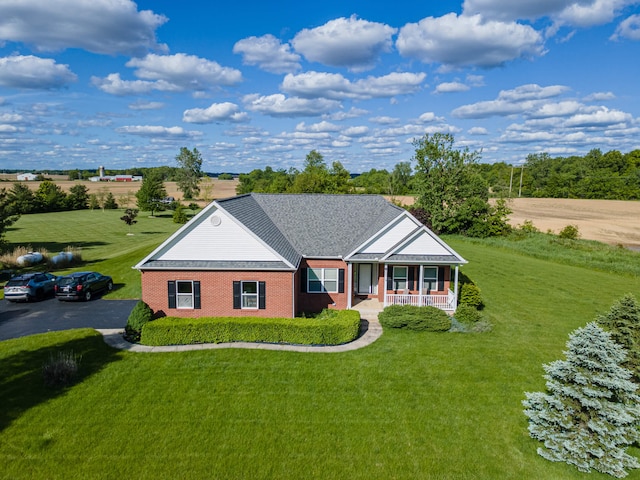 11370 Crottinger Rd, Plain City, OH 43064 - ranch-style house with covered porch, a front lawn, and brick siding
