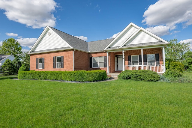 11370 Crottinger Rd, Plain City, OH 43064 - view of front of property with brick siding, a front lawn, and covered porch