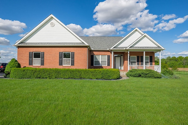 11370 Crottinger Rd, Plain City, OH 43064 - view of front of property featuring brick siding, a front yard, covered porch, and roof with shingles