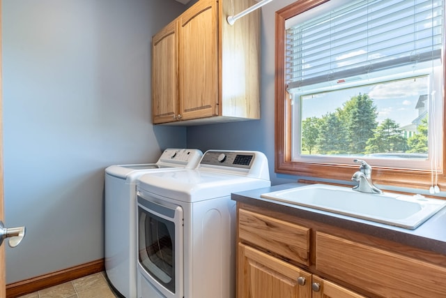 11370 Crottinger Rd, Plain City, OH 43064 - laundry area featuring cabinet space, washing machine and dryer, plenty of natural light, and baseboards