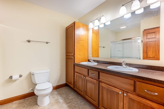 11370 Crottinger Rd, Plain City, OH 43064 - bathroom with double vanity, a shower stall, toilet, baseboards, and tile patterned floors
