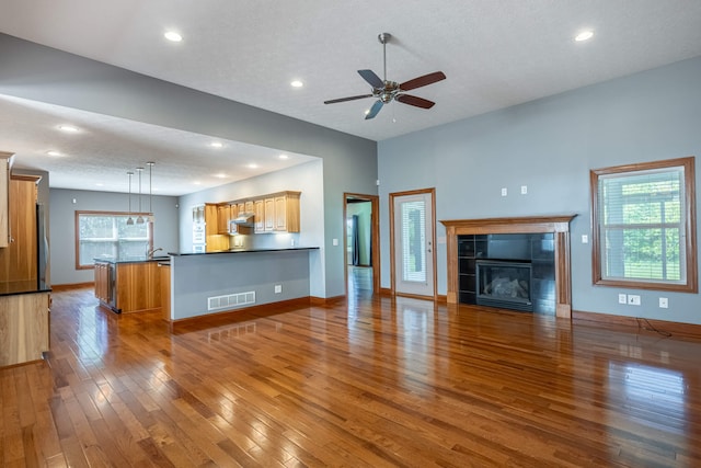 11370 Crottinger Rd, Plain City, OH 43064 - unfurnished living room with hardwood / wood-style floors, a ceiling fan, a fireplace, baseboards, and recessed lighting