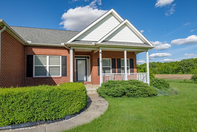 11370 Crottinger Rd, Plain City, OH 43064 - view of front of house with brick siding, a front lawn, and roof with shingles