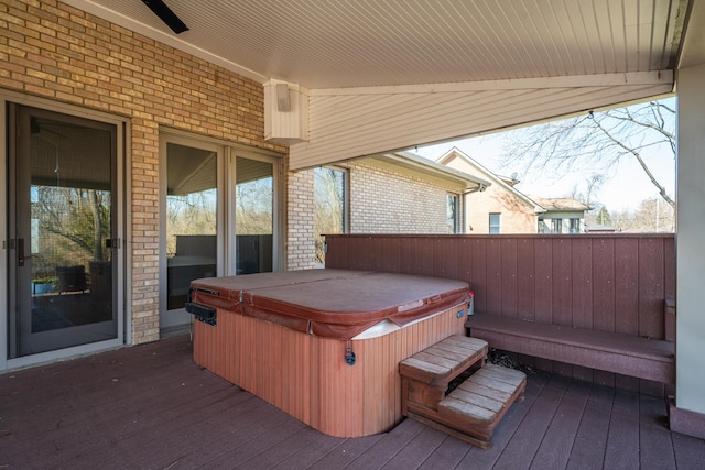 deck with a hot tub