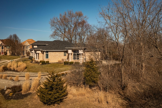 rear view of house with a yard