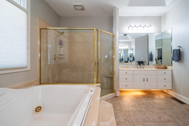 full bath with visible vents, vanity, a bath, and a shower stall