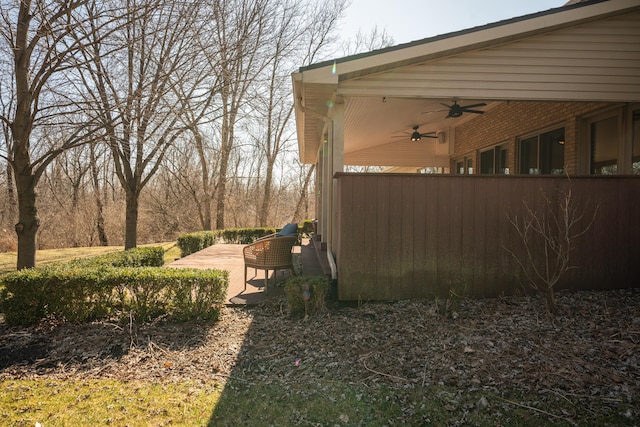 view of yard with ceiling fan