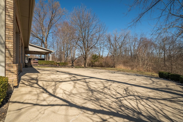 view of patio featuring concrete driveway