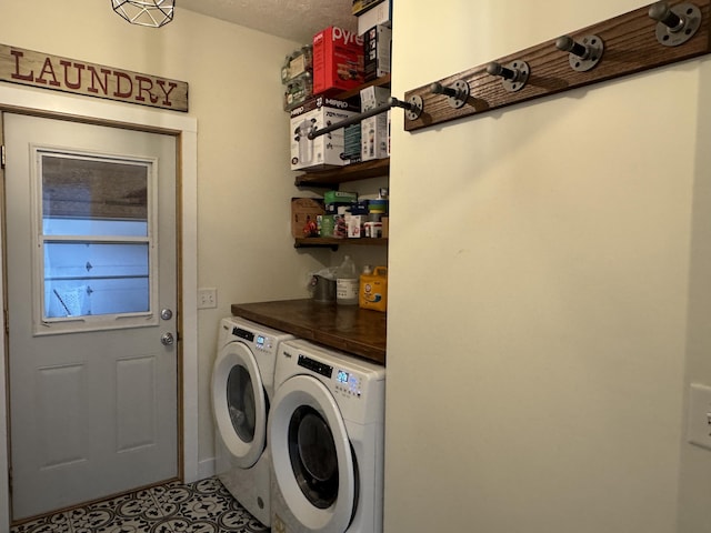 laundry area with washing machine and dryer