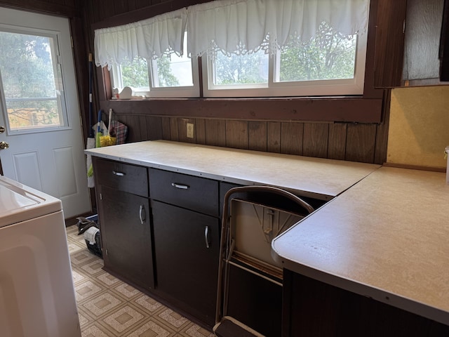 210 E Second St, Rockford, OH 45882 - kitchen with washer / dryer, light countertops, and dark cabinets
