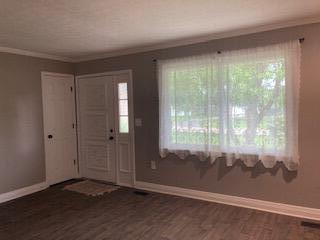 4173 Navajo Trl, Jamestown, OH 45335 - foyer with crown molding and wood finished floors