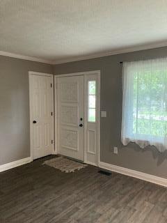 4173 Navajo Trl, Jamestown, OH 45335 - entryway with crown molding, plenty of natural light, and wood finished floors