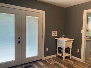 4173 Navajo Trl, Jamestown, OH 45335 - doorway with french doors and dark wood-type flooring