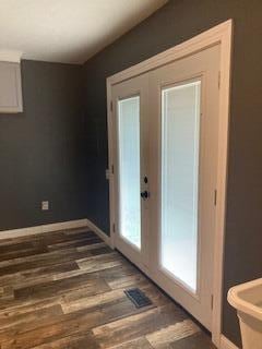 4173 Navajo Trl, Jamestown, OH 45335 - doorway to outside featuring wood finished floors and baseboards