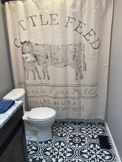 4173 Navajo Trl, Jamestown, OH 45335 - full bath featuring vanity, a shower with curtain, and tile patterned floors