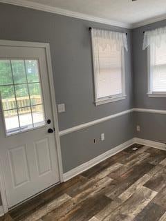 4173 Navajo Trl, Jamestown, OH 45335 - doorway to outside with ornamental molding and wood finished floors