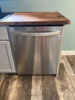 4173 Navajo Trl, Jamestown, OH 45335 - kitchen view of stainless steel dishwasher and wood finished floors