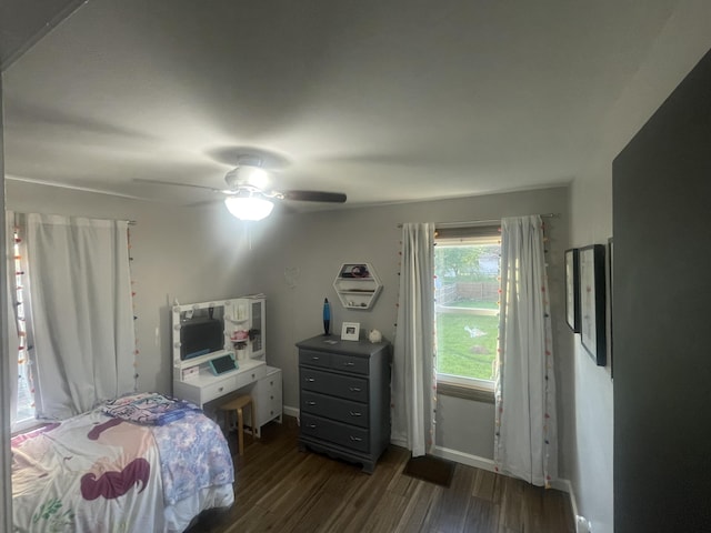 2412 W Spring St, Lima, OH 45805 - bedroom featuring dark wood finished floors, ceiling fan, and baseboards