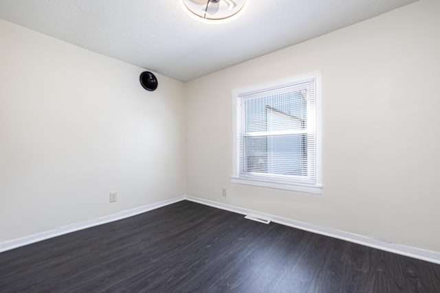 11068 Big Bear Path, Lakeview, OH 43331 - spare room with dark wood-style floors and baseboards