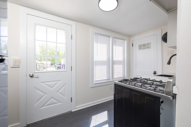 11068 Big Bear Path, Lakeview, OH 43331 - kitchen featuring gas range oven, dark wood finished floors, and baseboards