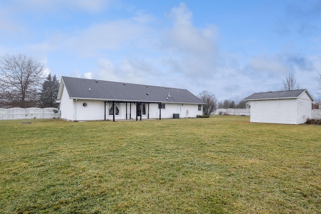 back of house featuring a yard