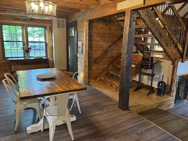 18866 Weimert School Rd, Wapakoneta, OH 45895 - dining room featuring a chandelier, dark wood-type flooring, wooden walls, and beam ceiling
