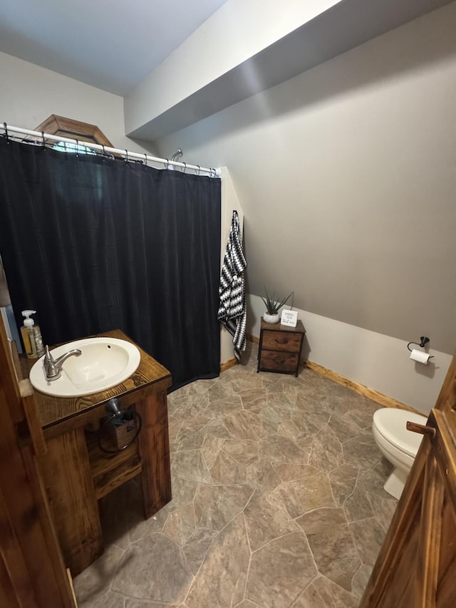 18866 Weimert School Rd, Wapakoneta, OH 45895 - full bath with toilet, stone finish flooring, vanity, and a shower with shower curtain