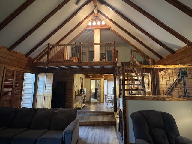18866 Weimert School Rd, Wapakoneta, OH 45895 - living room with high vaulted ceiling, wood-type flooring, wooden walls, and beam ceiling