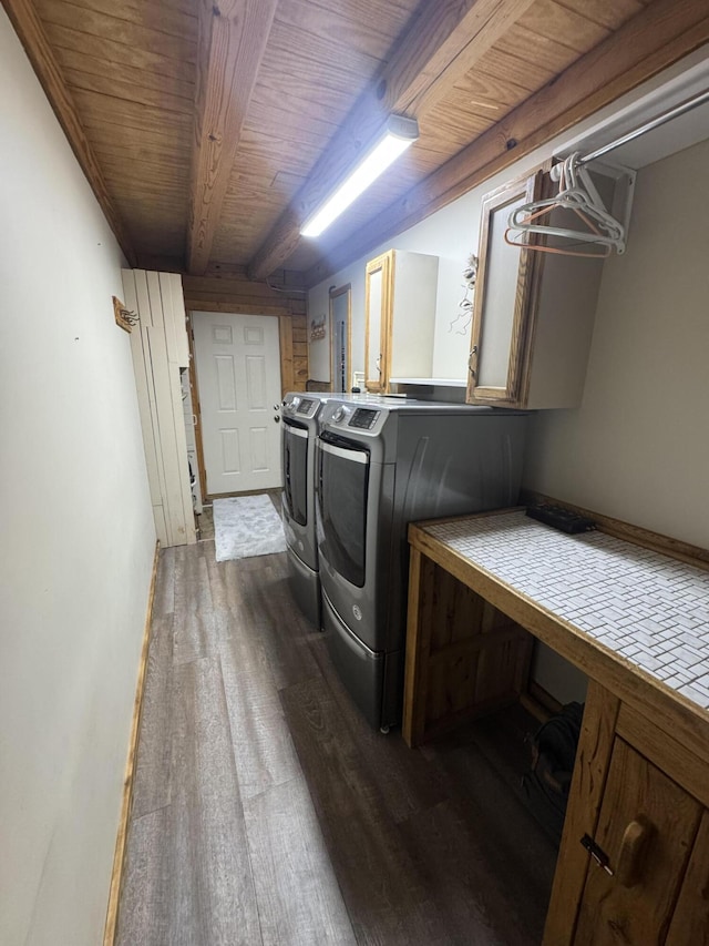 18866 Weimert School Rd, Wapakoneta, OH 45895 - washroom featuring dark wood-style flooring, washer and clothes dryer, wooden ceiling, and cabinet space