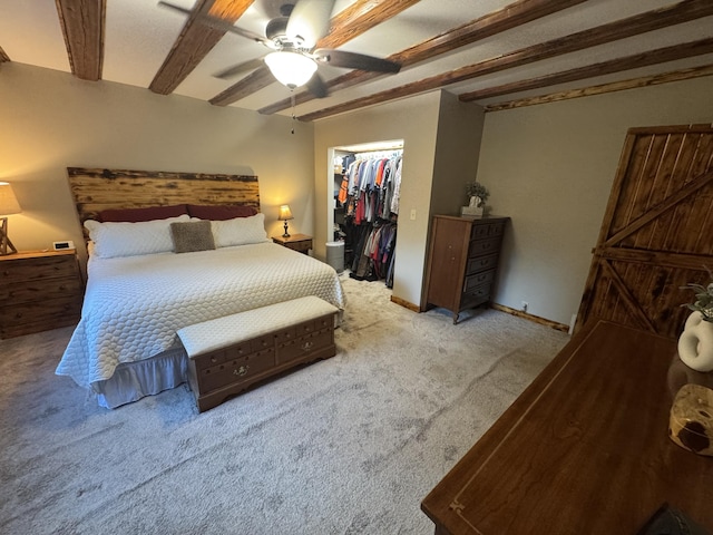 18866 Weimert School Rd, Wapakoneta, OH 45895 - carpeted bedroom with beam ceiling, a walk in closet, a closet, and a ceiling fan