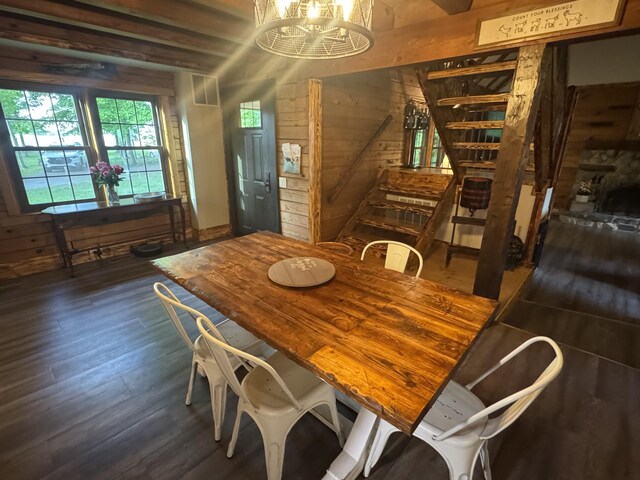 18866 Weimert School Rd, Wapakoneta, OH 45895 - dining area with wooden walls, dark wood finished floors, and a chandelier