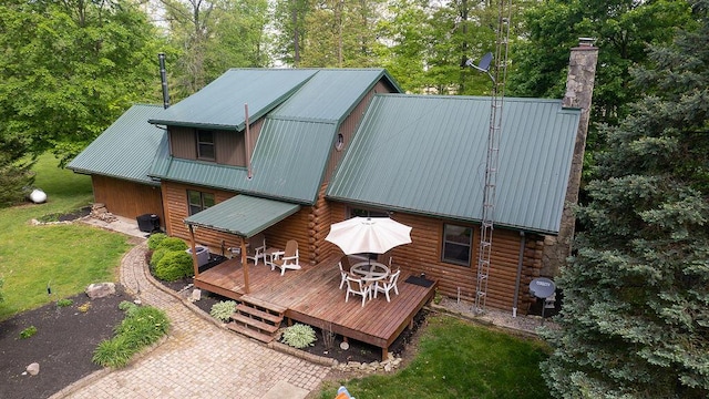 18866 Weimert School Rd, Wapakoneta, OH 45895 - rear view of property with a deck, a chimney, metal roof, log siding, and cooling unit