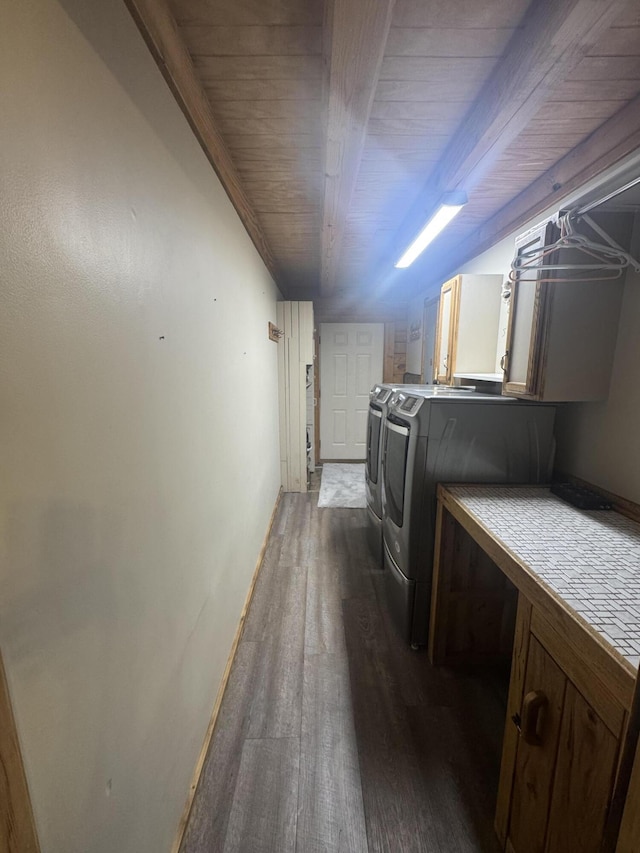 18866 Weimert School Rd, Wapakoneta, OH 45895 - clothes washing area with cabinet space, dark wood-style floors, and washer and dryer