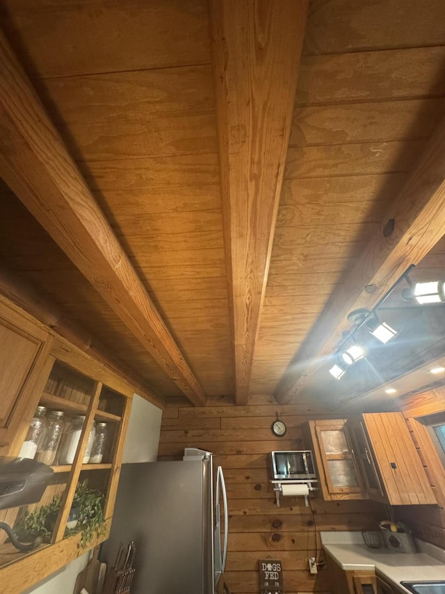 18866 Weimert School Rd, Wapakoneta, OH 45895 - kitchen with wood ceiling, freestanding refrigerator, wooden walls, and beam ceiling