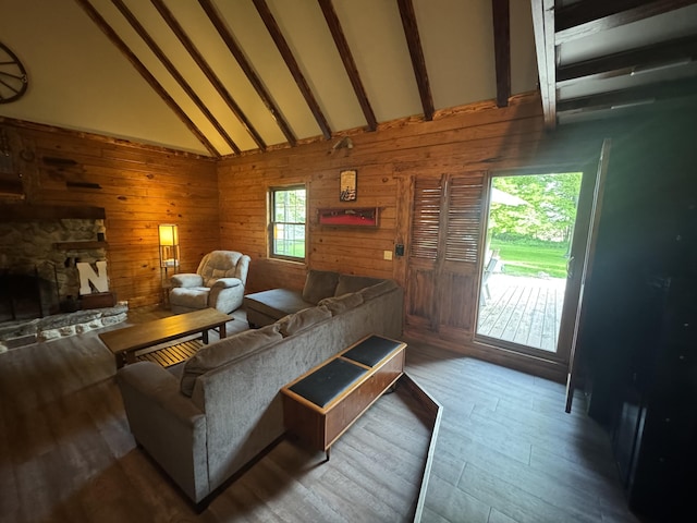 18866 Weimert School Rd, Wapakoneta, OH 45895 - living area featuring wood finished floors, high vaulted ceiling, beam ceiling, wooden walls, and a fireplace