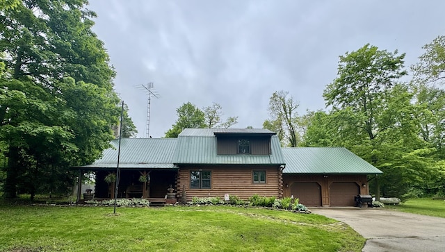 18866 Weimert School Rd, Wapakoneta, OH 45895 - log home featuring an attached garage, log exterior, a front lawn, driveway, and metal roof