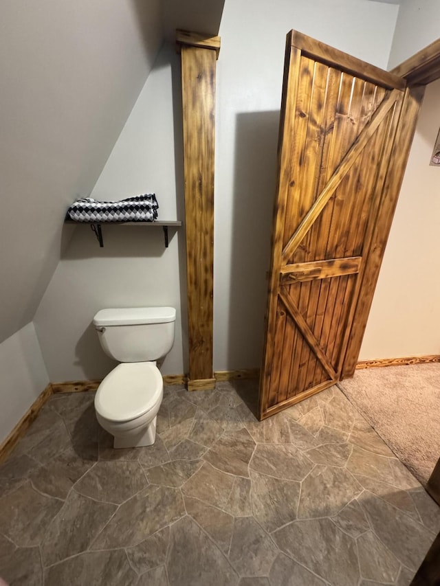 18866 Weimert School Rd, Wapakoneta, OH 45895 - bathroom with lofted ceiling, toilet, and baseboards