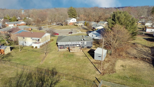 birds eye view of property with a residential view