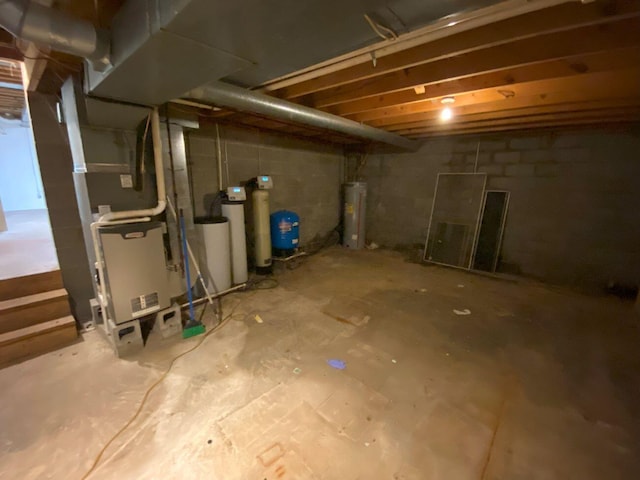 2700 Myeerah Trl, West Liberty, OH 43357 - unfinished below grade area with a water softener, water heater, and a water pressure tank