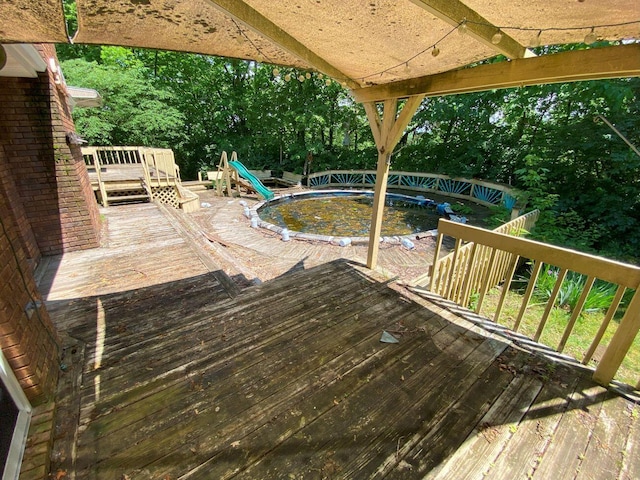 2700 Myeerah Trl, West Liberty, OH 43357 - wooden terrace with an outdoor pool and view of scattered trees