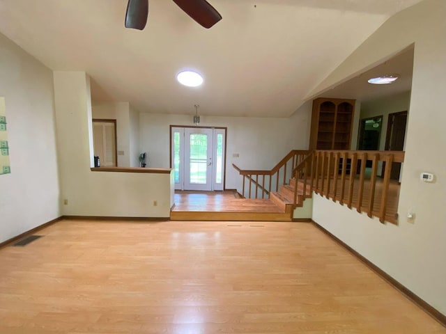 2700 Myeerah Trl, West Liberty, OH 43357 - spare room with wood finished floors, a ceiling fan, stairs, baseboards, and lofted ceiling