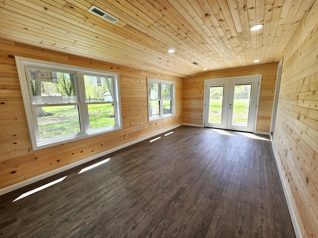 5412 Lock Two Rd, New Bremen, OH 45869 - spare room featuring french doors, visible vents, vaulted ceiling, dark wood-style floors, and wooden walls