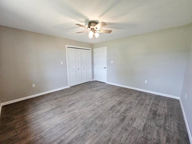 5412 Lock Two Rd, New Bremen, OH 45869 - unfurnished bedroom featuring baseboards, a ceiling fan, a closet, and dark wood-style flooring