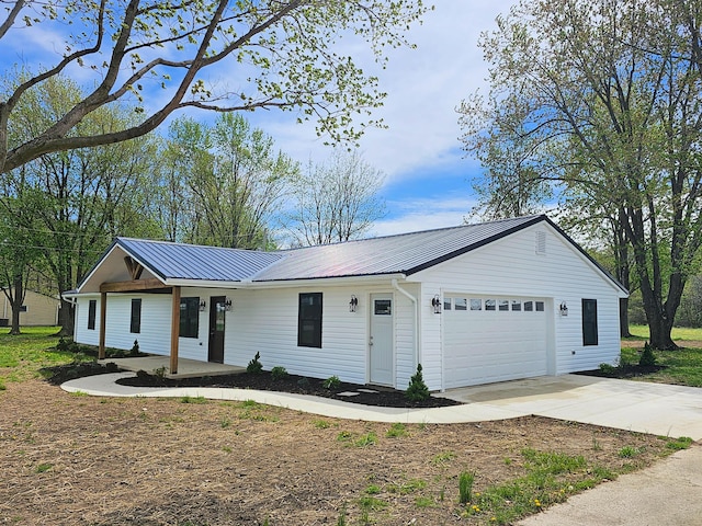 5412 Lock Two Rd, New Bremen, OH 45869 - single story home featuring concrete driveway, an attached garage, and metal roof