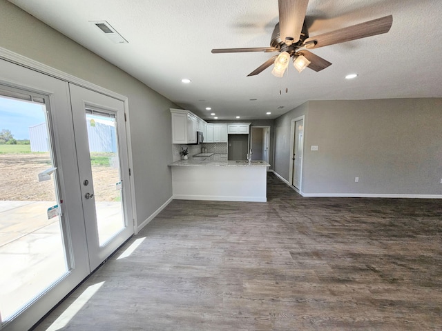 5412 Lock Two Rd, New Bremen, OH 45869 - unfurnished living room featuring recessed lighting, french doors, dark wood-style floors, and visible vents