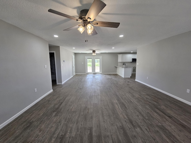 5412 Lock Two Rd, New Bremen, OH 45869 - unfurnished living room featuring ceiling fan, a textured ceiling, baseboards, recessed lighting, and dark wood-type flooring