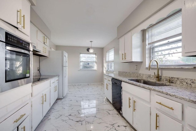 kitchen featuring baseboards, white cabinets, marble finish floor, black appliances, and a sink